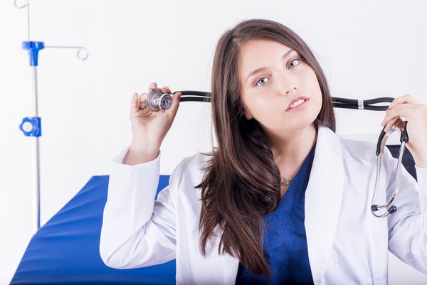 woman holding stethoscope