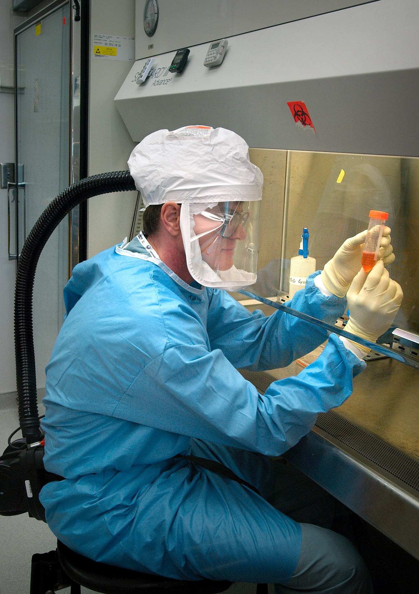 Microbiologist holding a test tube inside the laboratory